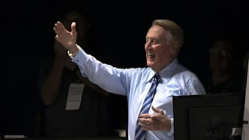 Sep 20, 2016; Los Angeles, CA, USA; Vin Scully waves to the crowd after a video tribute before the Los Angeles Dodgers played the San Francisco Giants at Dodger Stadium. The long-time Dodger broadcaster is retiring at the end of the regular season. Mandatory Credit: Robert Hanashiro-USA TODAY Sports