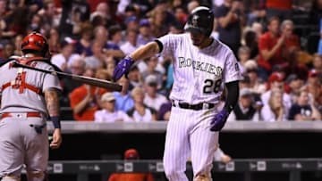 Sep 20, 2016; Denver, CO, USA; Colorado Rockies third baseman Nolan Arenado (28) throws his bat after striking out to end the fifth inning against the St. Louis Cardinals at Coors Field. Mandatory Credit: Ron Chenoy-USA TODAY Sports