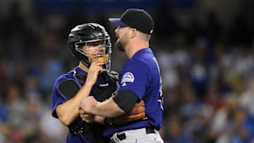 September 22, 2016; Los Angeles, CA, USA; Colorado Rockies catcher Nick Hundley (4) speaks with relief pitcher Boone Logan (48) during the seventh inning against the Los Angeles Dodgers at Dodger Stadium. Mandatory Credit: Gary A. Vasquez-USA TODAY Sports