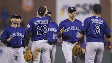 Sep 28, 2016; San Francisco, CA, USA; Colorado Rockies third baseman Nolan Arenado (28) and right fielder Hunter Pence (8) and shortstop Daniel Descalso (3) and center fielder Charlie Blackmon (19) and right fielder Carlos Gonzalez (5) celebrate after the end of the game against the San Francisco Giants at AT&T Park the Colorado Rockies defeated the San Francisco Giants 2 to 0. Mandatory Credit: Neville E. Guard-USA TODAY Sports