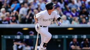 Oct 2, 2016; Denver, CO, USA; Colorado Rockies first baseman Jordan Patterson (72) follows his ball on an RBI double in the fifth inning against the Milwaukee Brewers at Coors Field. Mandatory Credit: Isaiah J. Downing-USA TODAY Sports
