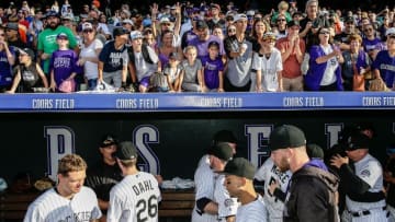Oct 2, 2016; Denver, CO, USA; Colorado Rockies fans cheer for players in the dugout following the game against the Milwaukee Brewers at Coors Field. Mandatory Credit: Isaiah J. Downing-USA TODAY Sports