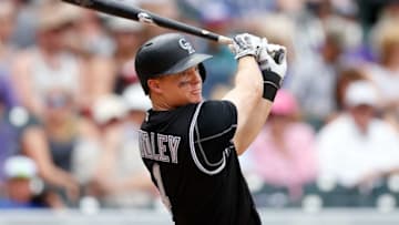 Jul 24, 2016; Denver, CO, USA; Colorado Rockies catcher Nick Hundley (4) watches his ball on an RBI single in the third inning against the Atlanta Braves at Coors Field. Mandatory Credit: Isaiah J. Downing-USA TODAY Sports