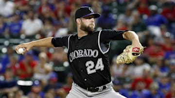Aug 10, 2016; Arlington, TX, USA; Colorado Rockies relief pitcher Jordan Lyles (24) throws in the eighth inning against the Texas Rangers at Globe Life Park in Arlington. Rangers won 5-4. Mandatory Credit: Ray Carlin-USA TODAY Sports