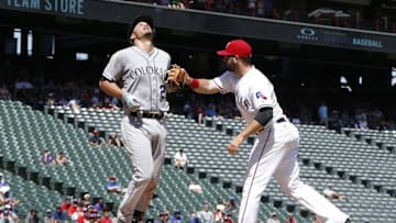 Aug 11, 2016; Arlington, TX, USA; Colorado Rockies third baseman Nolan Arenado (28) is tagged out by Texas Rangers first baseman Mitch Moreland (18) in the at Globe Life Park in Arlington. Mandatory Credit: Tim Heitman-USA TODAY Sports