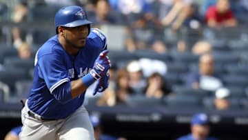 Sep 5, 2016; Bronx, NY, USA; Toronto Blue Jays first baseman Edwin Incarnation (10) hits a two run single against the New York Yankees at Yankee Stadium. Mandatory Credit: Wendell Cruz-USA TODAY Sports
