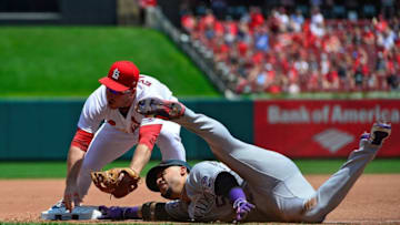 ST LOUIS, MO - AUGUST 02: Carlos Gonzalez #5 of the Colorado Rockies reaches for the bag after sliding off as Jedd Gyorko #3 of the St. Louis Cardinals applies the tag at third base during the fourth inning at Busch Stadium on August 2, 2018 in St Louis, Missouri. (Photo by Jeff Curry/Getty Images)