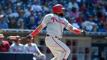 SAN DIEGO, CA - AUGUST 12: Carlos Santana #41 of the Philadelphia Phillies hits an RBI double during the eighth inning of a baseball game against the San Diego Padres at PETCO Park on August 12, 2018 in San Diego, California. (Photo by Denis Poroy/Getty Images)