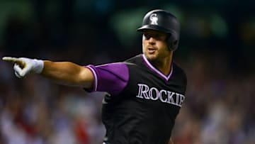 DENVER, CO - AUGUST 25: Matt Holliday #7 of the Colorado Rockies points to the dugout to celebrate after hitting a seventh inning solo homerun against the St. Louis Cardinals at Coors Field on August 25, 2018 in Denver, Colorado. Players are wearing special jerseys with their nicknames on them during Players' Weekend. (Photo by Dustin Bradford/Getty Images)