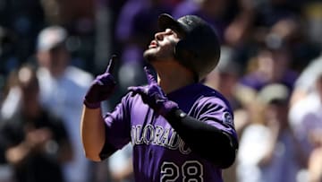 DENVER, CO - SEPTEMBER 13: Nolan Arenado #28 of the Colorado Rockies celebrates as he crosses the plate after hitting a home run in the first inning against the Arizona Diamondbacks at Coors Field on September 13, 2018 in Denver, Colorado. (Photo by Matthew Stockman/Getty Images)
