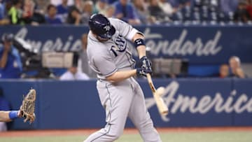 TORONTO, ON - SEPTEMBER 20: C.J. Cron #44 of the Tampa Bay Rays hits a three-run single in the seventh inning during MLB game action against the Toronto Blue Jays at Rogers Centre on September 20, 2018 in Toronto, Canada. (Photo by Tom Szczerbowski/Getty Images)