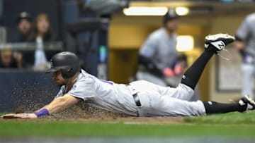 MILWAUKEE, WI - OCTOBER 04: Garrett Hampson #1 of the Colorado Rockies slides into home plate to score on a sacrifice fly hits a by teammate Nolan Arenado #28 (not pictured) in the ninth inning of Game One of the National League Division Series against the Milwaukee Brewers at Miller Park on October 4, 2018 in Milwaukee, Wisconsin. (Photo by Stacy Revere/Getty Images)
