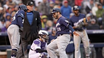 DENVER, CO - OCTOBER 07: Mike Moustakas #18 of the Milwaukee Brewers celebrates scoring on a balk by the pitcher Scott Oberg #45 of the Colorado Rockies in the sixth inning of Game Three of the National League Division Series at Coors Field on October 7, 2018 in Denver, Colorado. (Photo by Matthew Stockman/Getty Images)