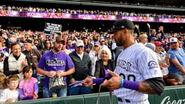 DENVER, CO - SEPTEMBER 30: Ian Desmond #20 of the Colorado Rockies gives high fives to fans during a fan appreciation walk around the field after the final game of the Colorado Rockies regular season against the Washington Nationals at Coors Field on September 30, 2018 in Denver, Colorado. (Photo by Dustin Bradford/Getty Images)