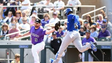 SCOTTSDALE, AZ - MARCH 15: Daniel Murphy #9 of the Colorado Rockies stretches to make a catch for a force out as Jorge Soler #12 of the Kansas City Royals runs to first base during the first inning of a spring training game at Salt River Fields at Talking Stick on March 15, 2019 in Scottsdale, Arizona. (Photo by Norm Hall/Getty Images)