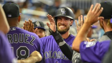 MIAMI, FL - MARCH 28: David Dahl #26 of the Colorado Rockies celebrates with teammates in the dugout in the fifth inning against the Miami Marlins during Opening Day at Marlins Park on March 28, 2019 in Miami, Florida. (Photo by Mark Brown/Getty Images)