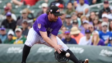 SCOTTSDALE, ARIZONA - MARCH 11: Daniel Murphy #9 of the Colorado Rockies fields a ground ball during the spring training game against the Oakland Athletics at Salt River Fields at Talking Stick on March 11, 2019 in Scottsdale, Arizona. (Photo by Jennifer Stewart/Getty Images)