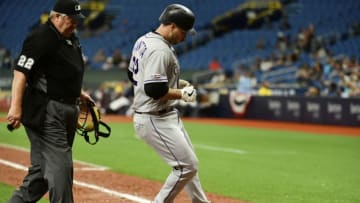 ST PETERSBURG, FLORIDA - APRIL 03: Chris Iannetta #22 of the Colorado Rockies touches home plate after hitting a homer off of Chaz Roe #52 of the Tampa Bay Rays in the 11th inning at Tropicana Field on April 03, 2019 in St Petersburg, Florida. The Rockies won 1-0. (Photo by Julio Aguilar/Getty Images)