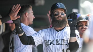 DENVER, CO - MAY 12: Charlie Blackmon #19 of the Colorado Rockies is congratulated in the dugout after hitting a two-run homer in the second inning of a game against the San Diego Padres at Coors Field on May 12, 2019 in Denver, Colorado. (Photo by Dustin Bradford/Getty Images)