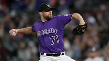 DENVER, COLORADO - MAY 11: Pitcher Wade Davis #71 of the Colorado Rockies throws in the ninth inning against the San Diego Padres at Coors Field on May 11, 2019 in Denver, Colorado. (Photo by Matthew Stockman/Getty Images)