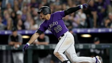 DENVER, COLORADO - MAY 25: Nolan Arenado #28 of the Colorado Rockies hits a RBI single in the fifth inning against the Baltimore Orioles at Coors Field on May 25, 2019 in Denver, Colorado. (Photo by Matthew Stockman/Getty Images)