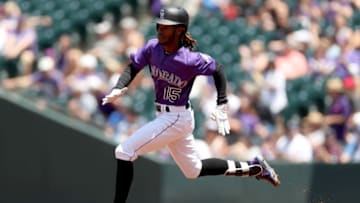 DENVER, COLORADO - MAY 30: Raimel Tapia #15 of the Colorado Rockies runs to second base after hitting a double in the first inning against the Arizona Diamondbacks at Coors Field on May 30, 2019 in Denver, Colorado. (Photo by Matthew Stockman/Getty Images)