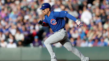 DENVER, COLORADO - JUNE 10: Carlos Gonzalez #2 of the Chicago Cubs runs to second base on a Victor Caratini hit in the second inning against the Colorado Rockies at Coors Field on June 10, 2019 in Denver, Colorado. (Photo by Matthew Stockman/Getty Images)