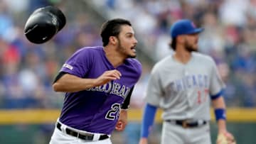 DENVER, COLORADO - JUNE 11: Nolan Arenado #28 of the Colorado Rockies rounds third base to score on a Daniel Murphy 2 RBI double in the first inning against the Chicago Cubs at Coors Field on June 11, 2019 in Denver, Colorado. (Photo by Matthew Stockman/Getty Images)