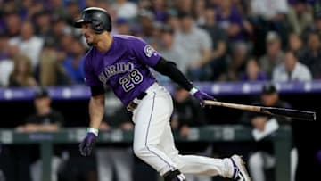 DENVER, COLORADO - JUNE 11: Nolan Arenado #28 of the Colorado Rockies hits a RBI single in the fifth inning against the Chicago Cubs at Coors Field on June 11, 2019 in Denver, Colorado. (Photo by Matthew Stockman/Getty Images)