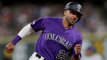 DENVER, COLORADO - JUNE 11: Ian Desmond #20 of the Colorado Rockies scores on a Chris Iannetta RBI single in the sixth inning against the Chicago Cubs at Coors Field on June 11, 2019 in Denver, Colorado. (Photo by Matthew Stockman/Getty Images)