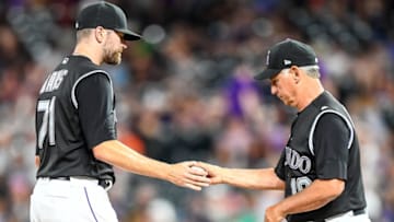 DENVER, CO - JULY 16: Manager Bud Black #10 of the Colorado Rockies takes Wade Davis #71 out of the game in the 10th inning against the San Francisco Giants at Coors Field on July 16, 2019 in Denver, Colorado. (Photo by Dustin Bradford/Getty Images)