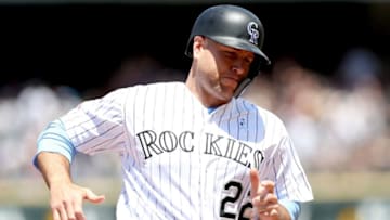 DENVER, COLORADO - JUNE 16: Chris Iannetta #22 of the Colorado Rockies rounds third base to score on a fielding error on a hit by Charlie Blackmon in the first inning against the San Diego Padres at Coors Field on June 16, 2019 in Denver, Colorado. (Photo by Matthew Stockman/Getty Images)