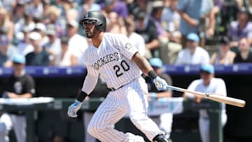 DENVER, COLORADO - JUNE 16: Ian Desmond #20 of the Colorado Rockies hits a RBI double in the first inning against the San Diego Padres at Coors Field on June 16, 2019 in Denver, Colorado. (Photo by Matthew Stockman/Getty Images)