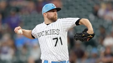 DENVER, COLORADO - JUNE 16: Pitcher Wade Davis #71 of the Colorado Rockies throws in the ninth inning against the San Diego Padres at Coors Field on June 16, 2019 in Denver, Colorado. (Photo by Matthew Stockman/Getty Images)