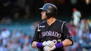 PHOENIX, ARIZONA - JUNE 18: Trevor Story #27 of the Colorado Rockies reacts while at bat in the first inning of a MLB game against the Arizona Diamondbacks at Chase Field on June 18, 2019 in Phoenix, Arizona. (Photo by Jennifer Stewart/Getty Images)