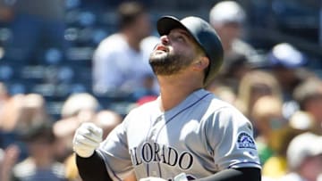 SAN DIEGO, CA - AUGUST 11: Yonder Alonso #13 of the Colorado Rockies looks skyward after hitting a two-run home run during the sixth inning of a baseball game against the San Diego Padres at Petco Park August 11, 2019 in San Diego, California. (Photo by Denis Poroy/Getty Images)