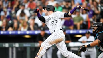 DENVER, CO - AUGUST 17: Trevor Story #27 of the Colorado Rockies follows the flight of a second inning two-run homer against the Miami Marlins at Coors Field on August 17, 2019 in Denver, Colorado. (Photo by Dustin Bradford/Getty Images)