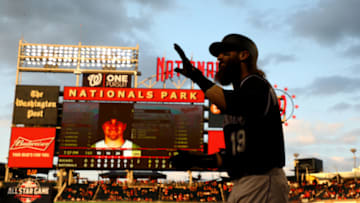 WASHINGTON, DC - JULY 25: Charlie Blackmon #19 of the Colorado Rockies celebrates after scoring the go ahead run in the ninth inning against the Washington Nationals at Nationals Park on July 25, 2019 in Washington, DC. (Photo by Rob Carr/Getty Images)