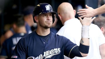 MILWAUKEE, WISCONSIN - JULY 28: Yasmani Grandal #10 of the Milwaukee Brewers celebrates with teammates after scoring a run in the fifth inning against the Chicago Cubs at Miller Park on July 28, 2019 in Milwaukee, Wisconsin. (Photo by Dylan Buell/Getty Images)