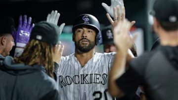 DENVER, CO - AUGUST 30: Ian Desmond #20 of the Colorado Rockies is congratulated in the dugout after his home run against the Pittsburgh Pirates in the eighth inning at Coors Field on August 30, 2019 in Denver, Colorado. Pittsburgh won 9-4. (Photo by Joe Mahoney/Getty Images)