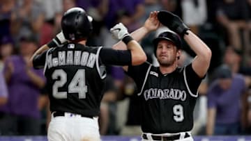 DENVER, COLORADO - AUGUST 02: Ryan McMahon #24 of the Colorado Rockies is congratulated by Daniel Murphy #9 after hitting a 2 RBI home run in the sixth inning against the San Francisco Giants at Coors Field on August 02, 2019 in Denver, Colorado. (Photo by Matthew Stockman/Getty Images)
