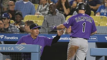 LOS ANGELES, CA - SEPTEMBER 20: Manager Bud Black #10 of the Colorado Rockies congratulates Garrett Hampson #1 after he scored on a single by Tony Wolters #14 of the Colorado Rockies in the second inning against the Los Angeles Dodgers at Dodger Stadium on September 20, 2019 in Los Angeles, California. (Photo by John McCoy/Getty Images)
