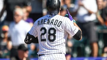DENVER, CO - SEPTEMBER 1: Nolan Arenado #28 of the Colorado Rockies celebrates after hitting a sixth inning solo home run against the Pittsburgh Pirates at Coors Field on September 1, 2019 in Denver, Colorado. (Photo by Dustin Bradford/Getty Images)