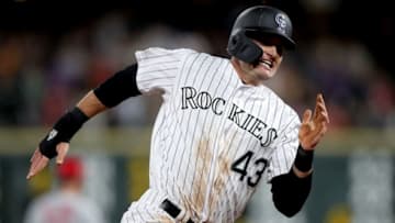 DENVER, COLORADO - SEPTEMBER 11: Sam Hilliard #43 of the Colorado Rockies rounds the bases to score on a Tony Wolters double in the fifth inning against the St Louis Cardinals at Coors Field on September 11, 2019 in Denver, Colorado. (Photo by Matthew Stockman/Getty Images)