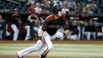 PHOENIX, ARIZONA - SEPTEMBER 16: Jake Lamb #22 of the Arizona Diamondbacks hits a 3-RBI double against the Miami Marlins during the seventh inning of the MLB game at Chase Field on September 16, 2019 in Phoenix, Arizona. (Photo by Ralph Freso/Getty Images)