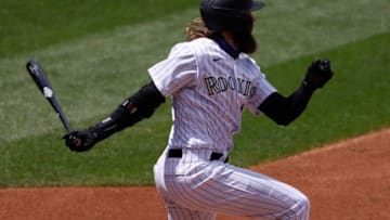 DENVER, CO - AUGUST 12: Charlie Blackmon #19 of the Colorado Rockies hits fielders choice during the third inning against the Arizona Diamondbacks at Coors Field on August 12, 2020 in Denver, Colorado. (Photo by Justin Edmonds/Getty Images)