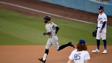 LOS ANGELES, CA - SEPTEMBER 04: Raimel Tapia #15 of the Colorado Rockies rounds the bases after hitting lead-off home run against pitcher Dustin May #85 of the Los Angeles Dodgers during the first inning at Dodger Stadium on September 4, 2020 in Los Angeles, California. (Photo by Kevork Djansezian/Getty Images)