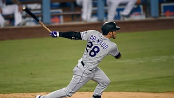 LOS ANGELES, CA - SEPTEMBER 06: Nolan Arenado #28 of the Colorado Rockies hits a base hit to score Raimel Tapia #15 of the Colorado Rockies from third base during the fifth inning against the Los Angeles Dodgers at Dodger Stadium on September 6, 2020 in Los Angeles, California. (Photo by Kevork Djansezian/Getty Images)