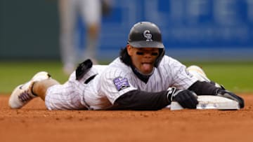 DENVER, CO - MAY 16: Connor Joe #9 of the Colorado Rockies sticks his tongue out after an RBI double during the fourth inning against the Cincinnati Reds at Coors Field on May 16, 2021 in Denver, Colorado. (Photo by Justin Edmonds/Getty Images)
