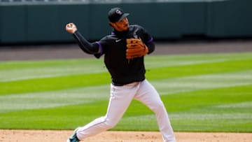 DENVER, CO - JULY 4: Nolan Arenado #28 of the Colorado Rockies throws to second base after fielding a ground ball during Major League Baseball Summer Workouts at Coors Field on July 4, 2020 in Denver, Colorado. (Photo by Justin Edmonds/Getty Images)